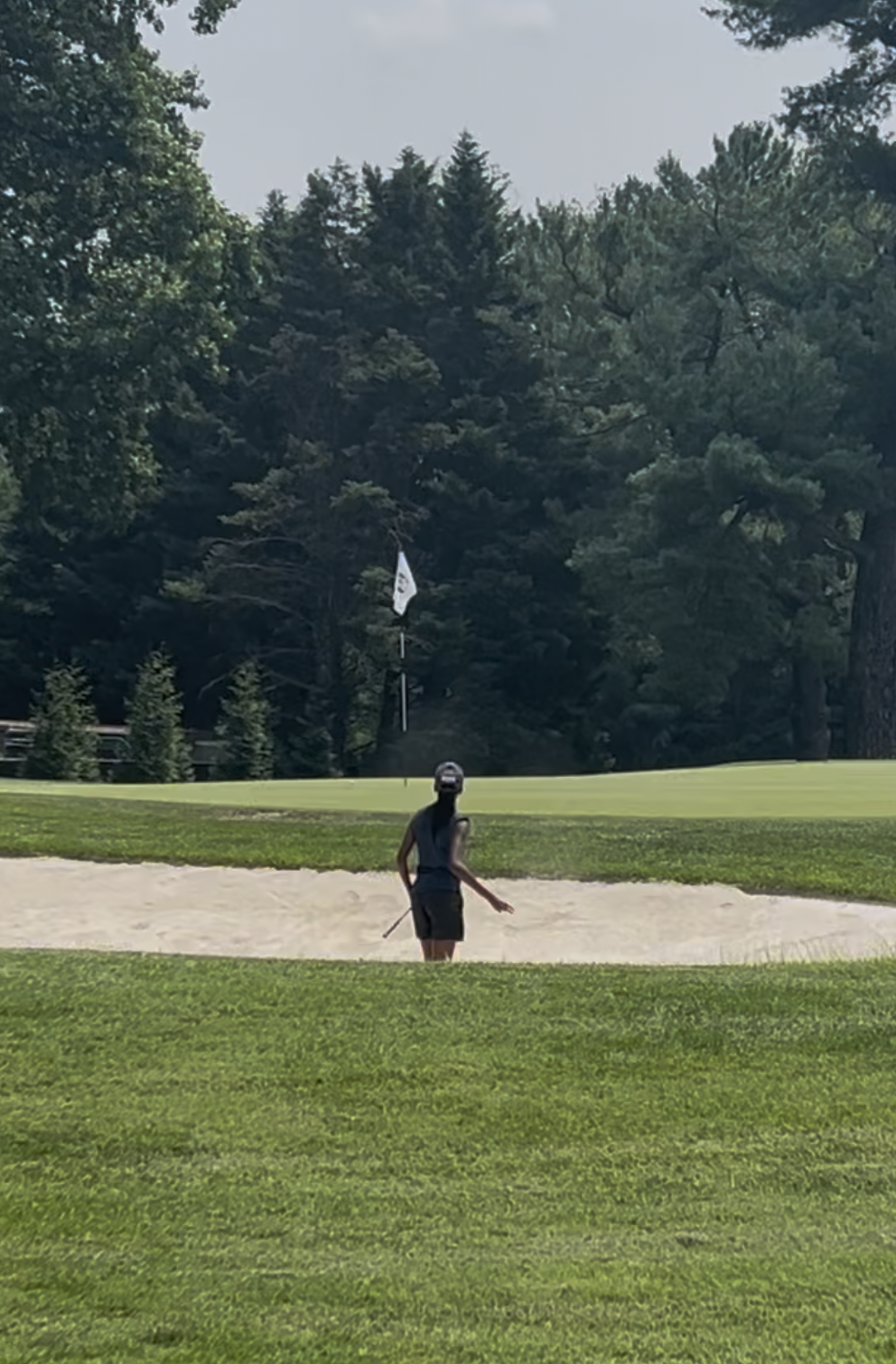 Splashing out of the greenside bunker at Kenwood